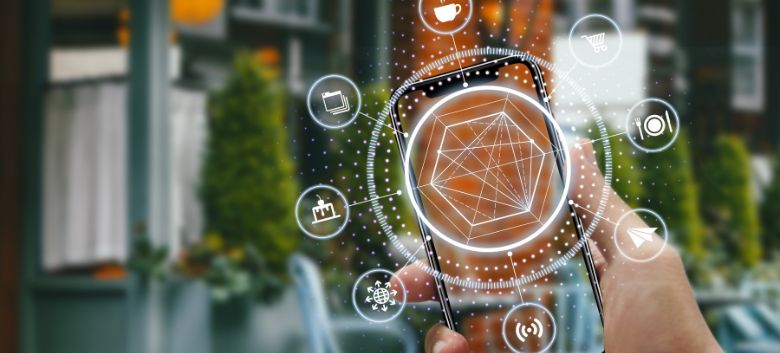 Smartphone displaying a holographic network of icons, illustrating connected mobile services.