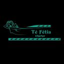 Té Fétia Charter logo: turquoise line art of a person lounging on a boat with waves and the company name against a black background