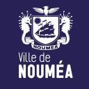 Logo for the City of Nouméa: a crest with a sailing ship, flanked by seahorses, a bird atop, and the banner reading Nouméa on a dark blue background.